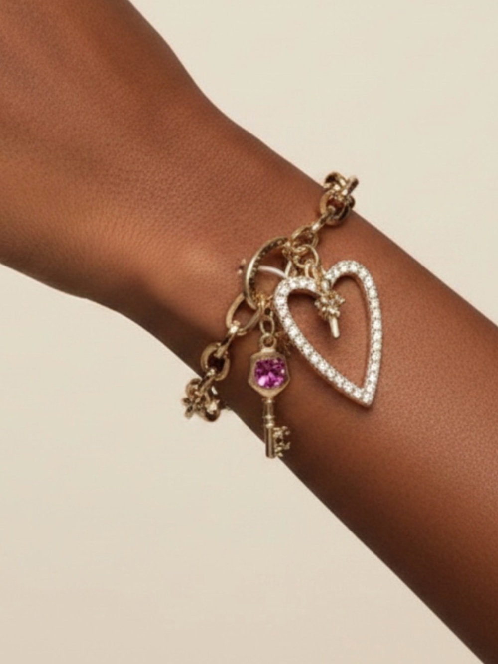 Juicy Couture Gold Bracelet with Heart and Key Charms or heart and bow charms